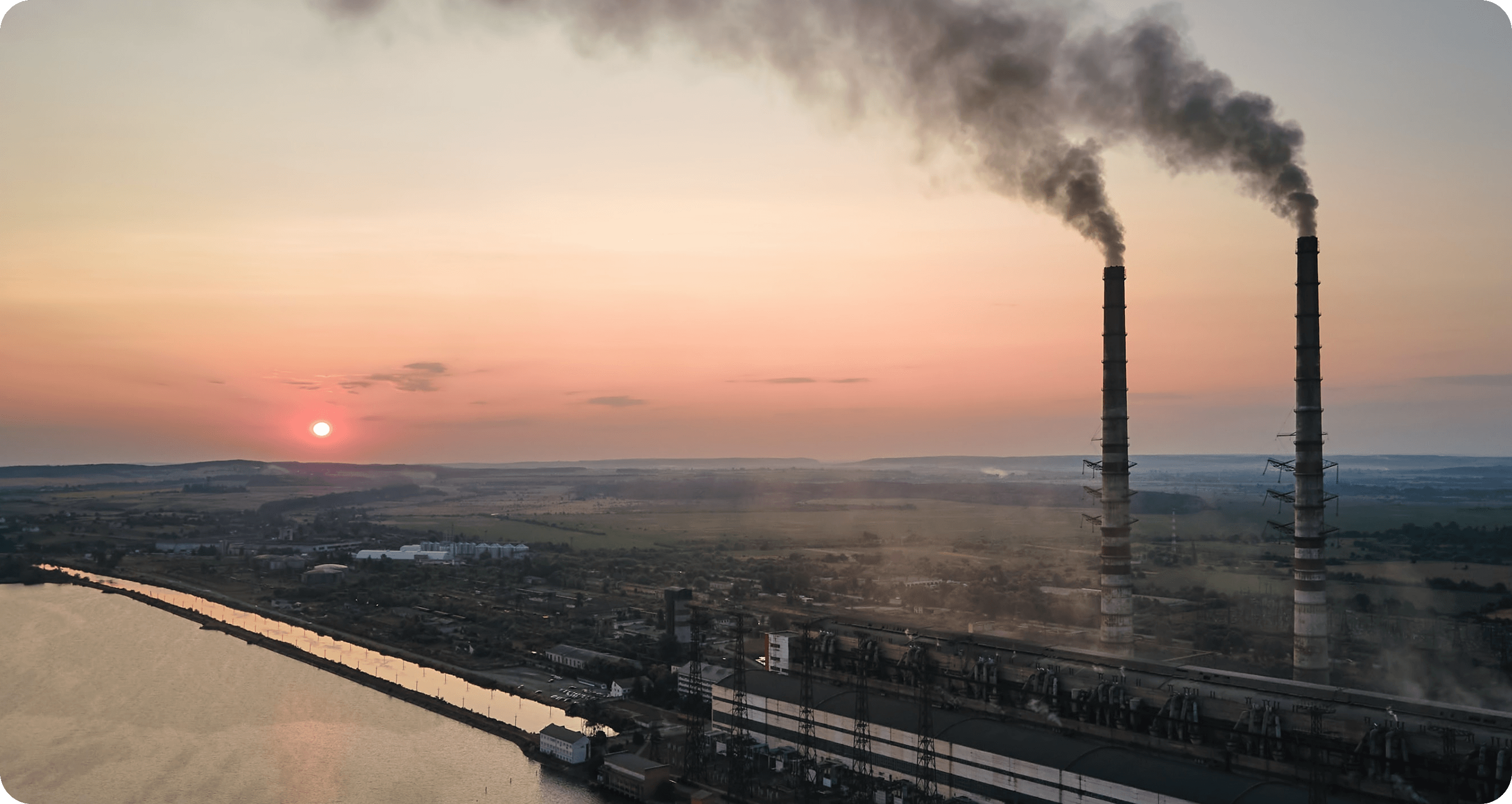 Industrial chimneys billowing smoke